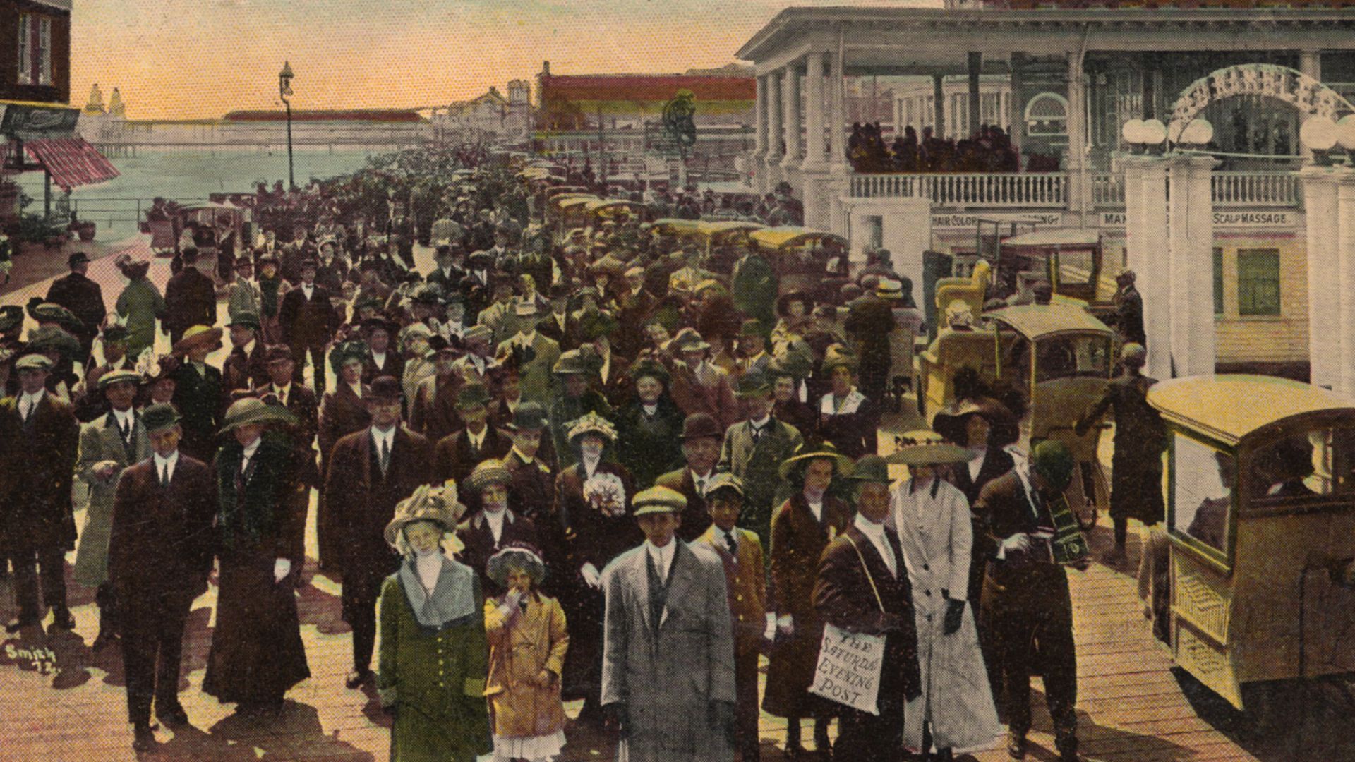 Glossy color postcard of crowded boardwalk in Atlantic City, New Jersey. Back is divided and reads