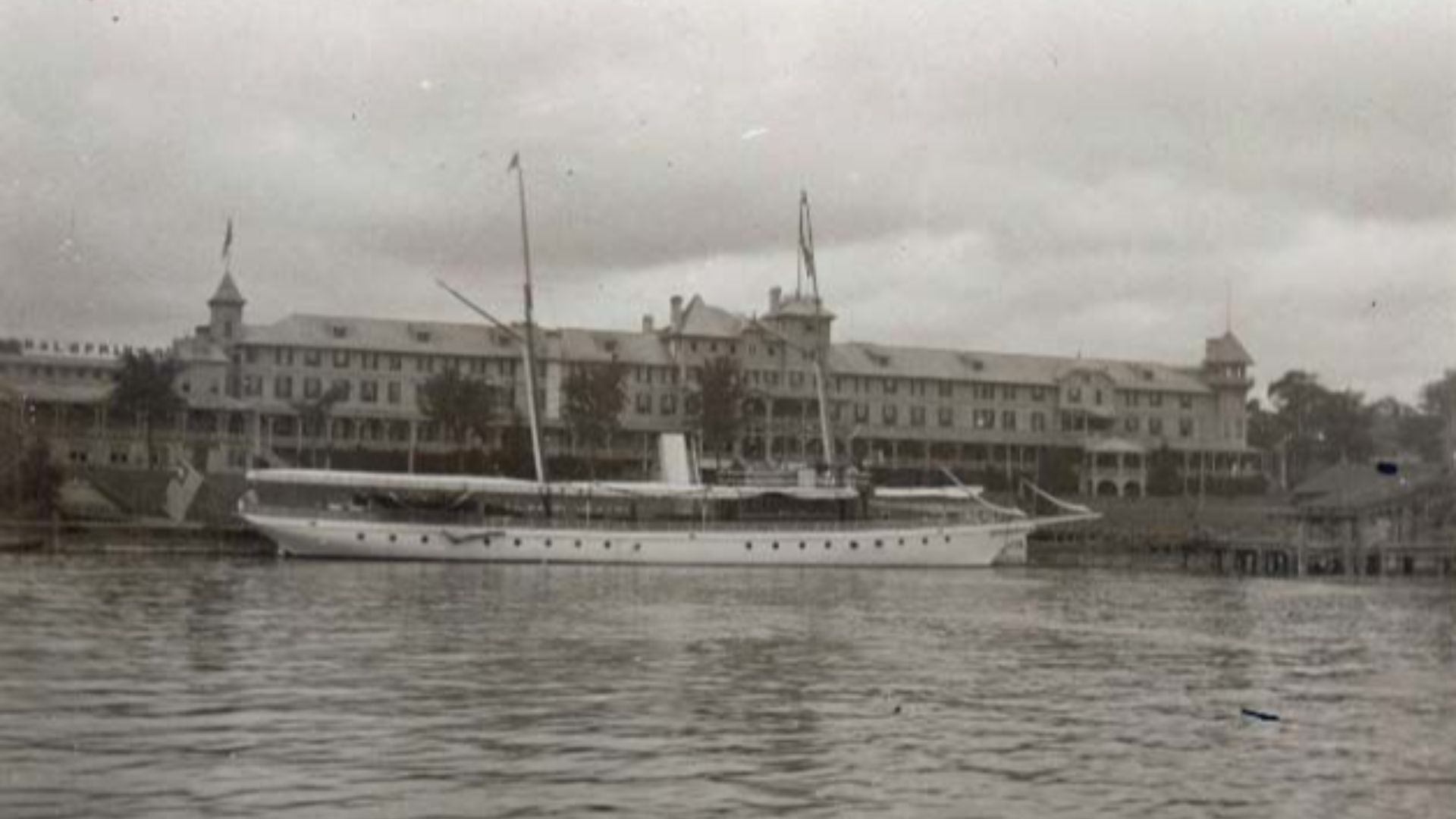 From the Antone S. Zeitler photograph album, an early twentieth century view of the Grand Hotel at Mackinac Island, Michigan. An excursion boat, the Sigma, is docked at the pier in front of the hotel. Terms associated with the photograph are: piers | Sigm