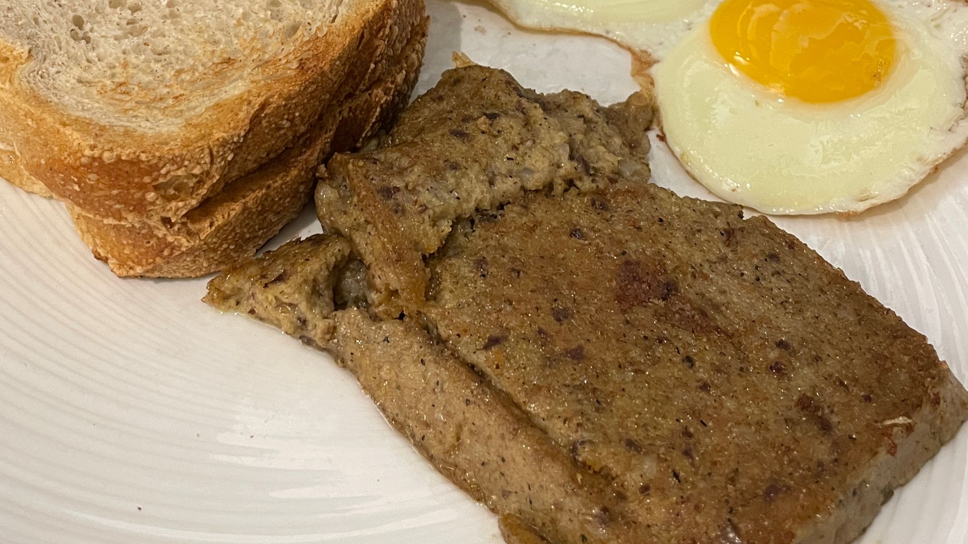 Scrapple with sunny-side up eggs and sourdough toast for breakfast at Pine Barn Inn, Danville, Pennsylvania, 2026-08-22
