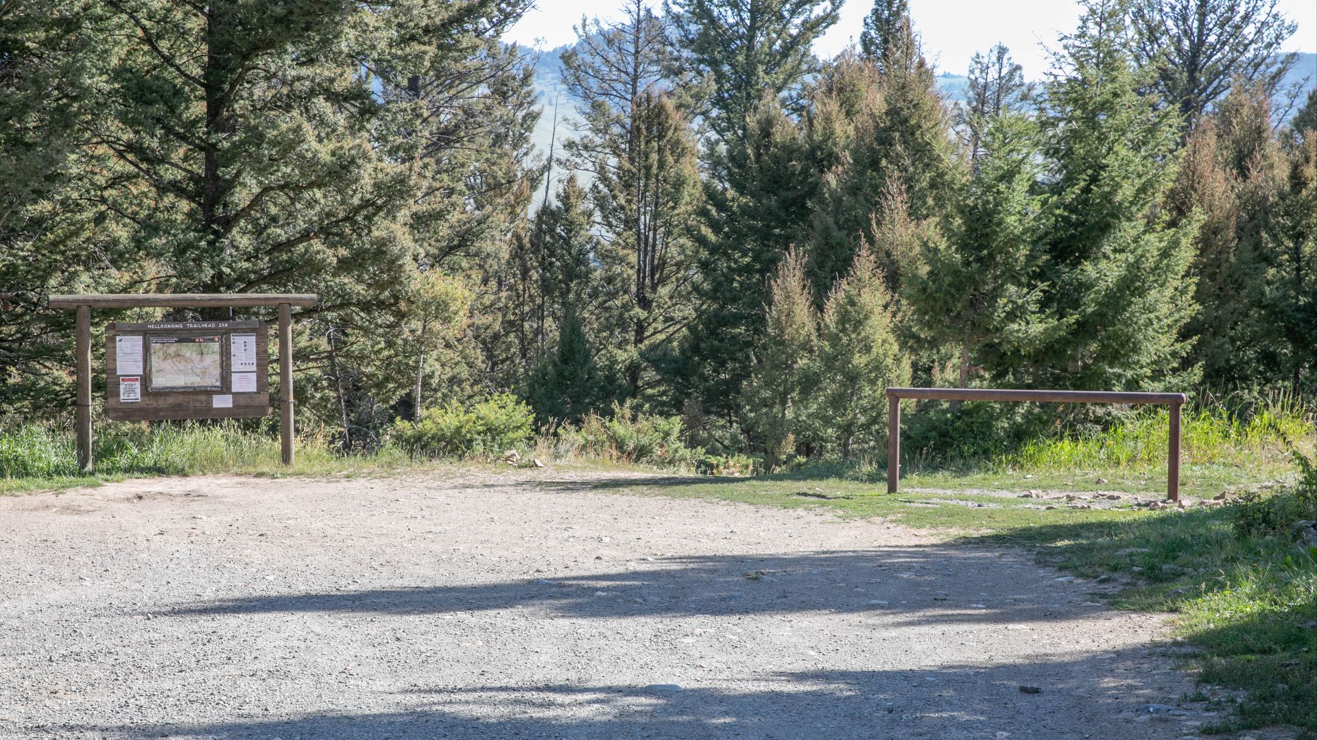 The trail is seen from the parking lot and has a trail sign board on the left and a horse hitching post on the right.
Hellroaring Creek Trailhead
Keywords: yellowstone national park; trails; visitor activities; 20190820-dmr-8751