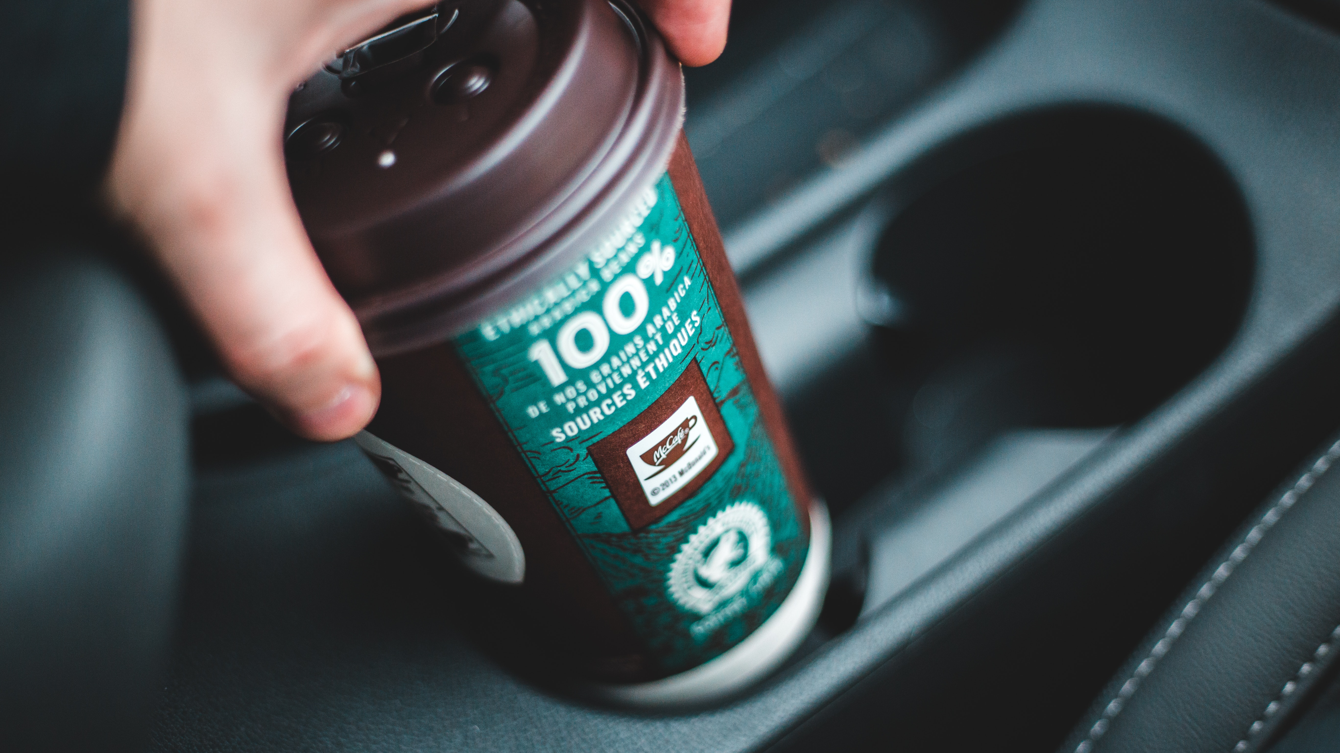 Coffee cup in car cup holder