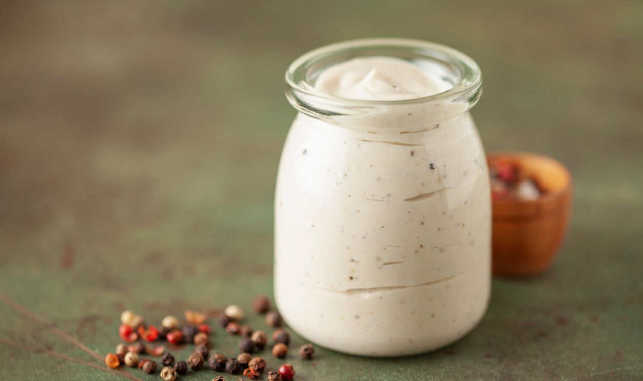 Alabama white BBQ sauce in bowl and ingredient for dip