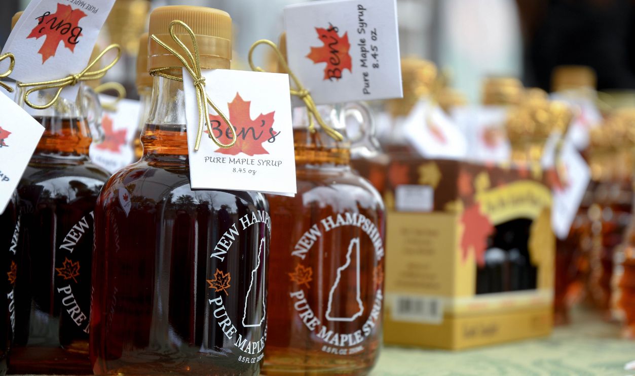 Temple, N.H./USA -- March 24, 2018: Bottles of maple syrup at Ben's Sugar Shack on New Hampshire Maple Weekend, when syrup producers open their doors to tourists and show how they turn sap to syrup.