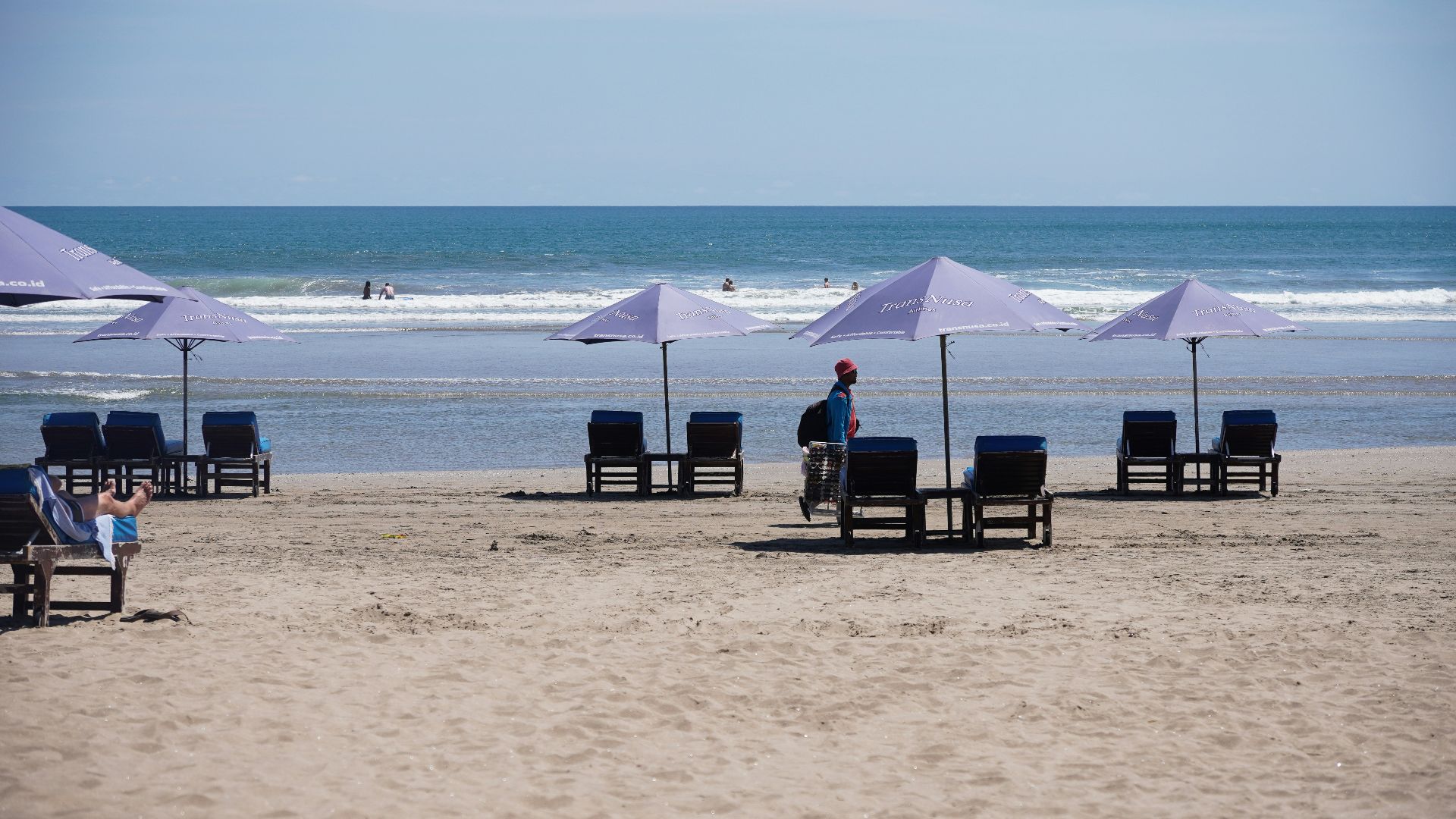 Beach chairs and umbrellas on a sandy shore