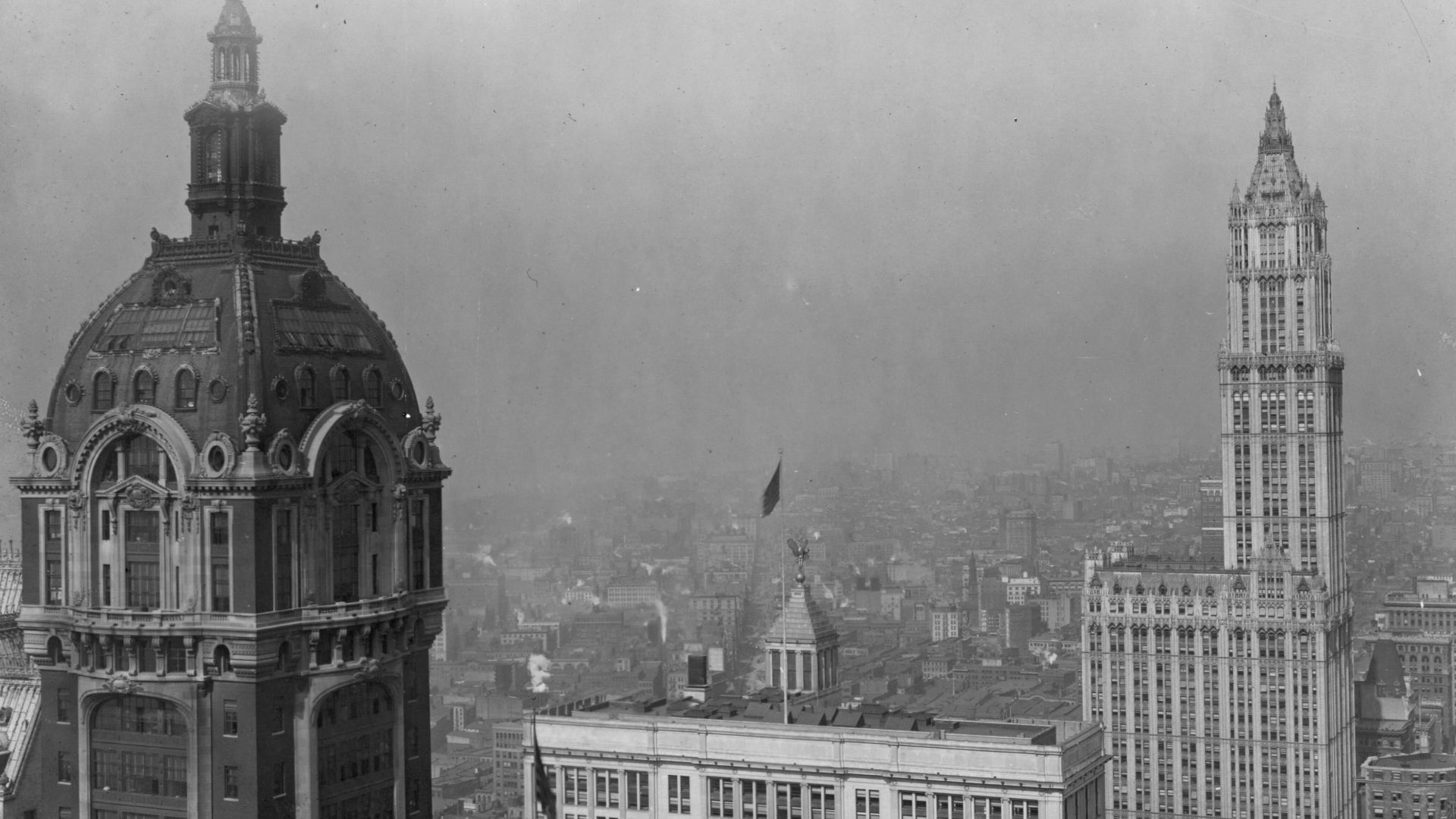 The Singer Building (left), and the Woolworth Building (right), pictured circa 1918

view from the Equitable Building

description from
https://digitalcollections.nypl.org/items/45e9a2b0-c549-012f-0217-58d385a7bc34?canvasIndex=1 :
Broadway, north from Lib