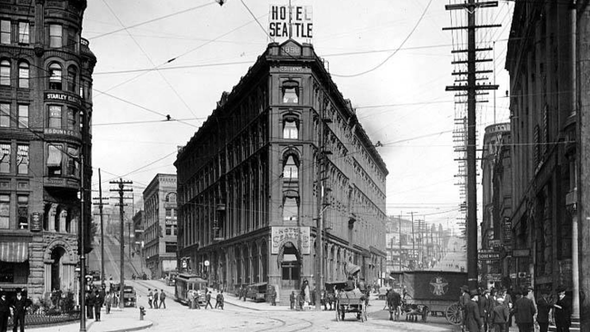 Caption on image: W&S 1630
Subjects (LCTGM): Hotels--Washington (State)--Seattle; Street railroads--Washington (State)--Seattle; Street lights--Washington (State)--Seattle; People--Washington (State)--Seattle; Cobblestone streets--Washington (State)--Seat