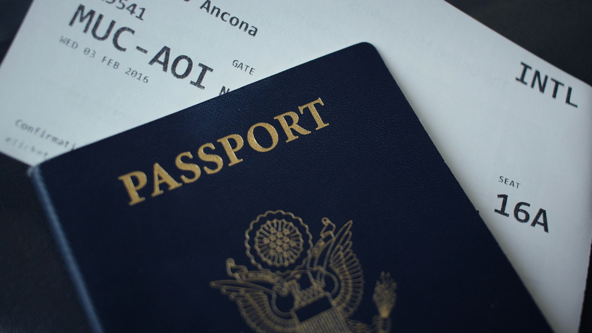 passport booklet on top of white paper