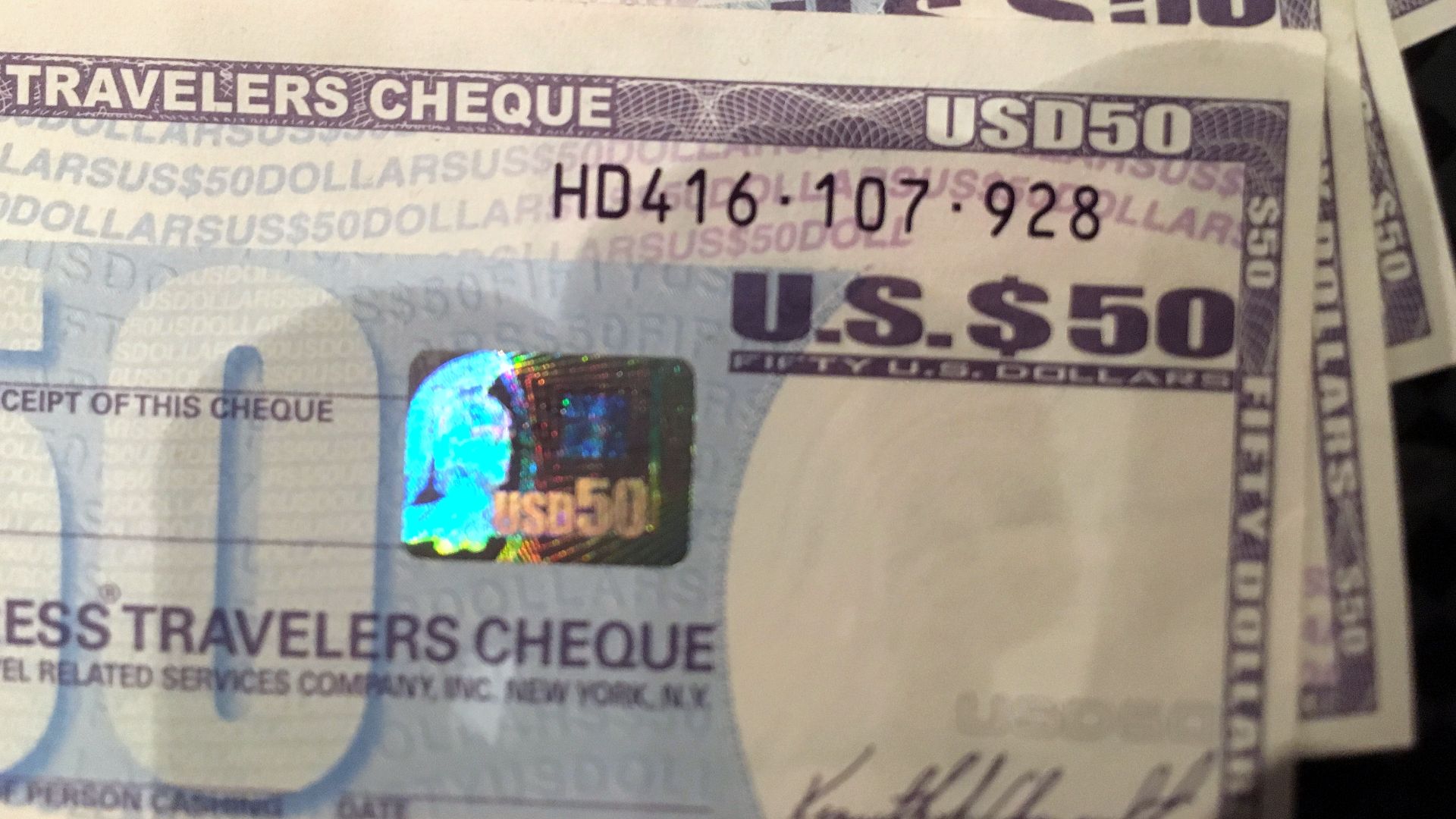 Four Travelers Cheques of 50 USD each, issued by American Express, bought ca. 2012, have long been spent. Soon after the photo was taken in 2016, they were changed back to cash.