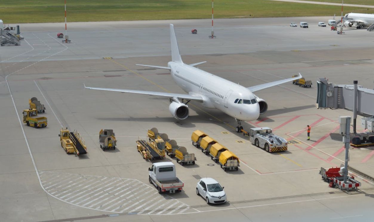Vehicles around Airplane on Tarmac