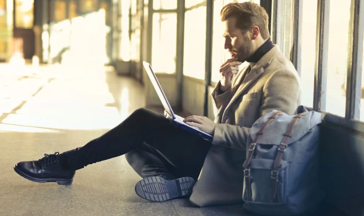 Brown Haired Man Using Laptop Computer