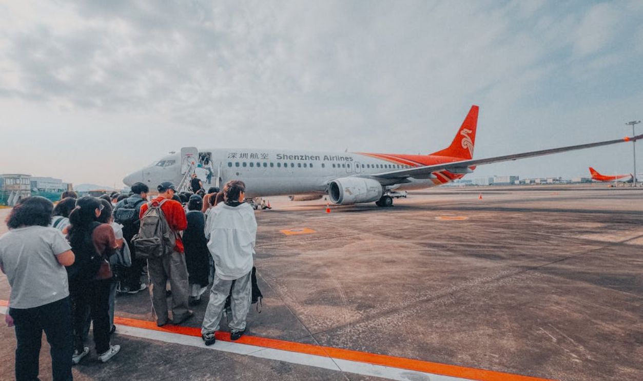 Travelers Boarding Shenzhen Airlines Plane