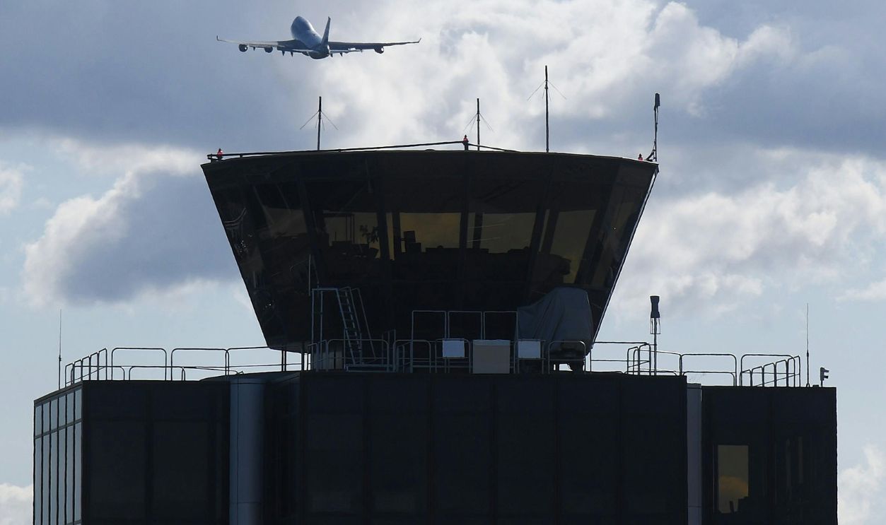 Airplane Takeoff Over Geneva Airport Control Tower