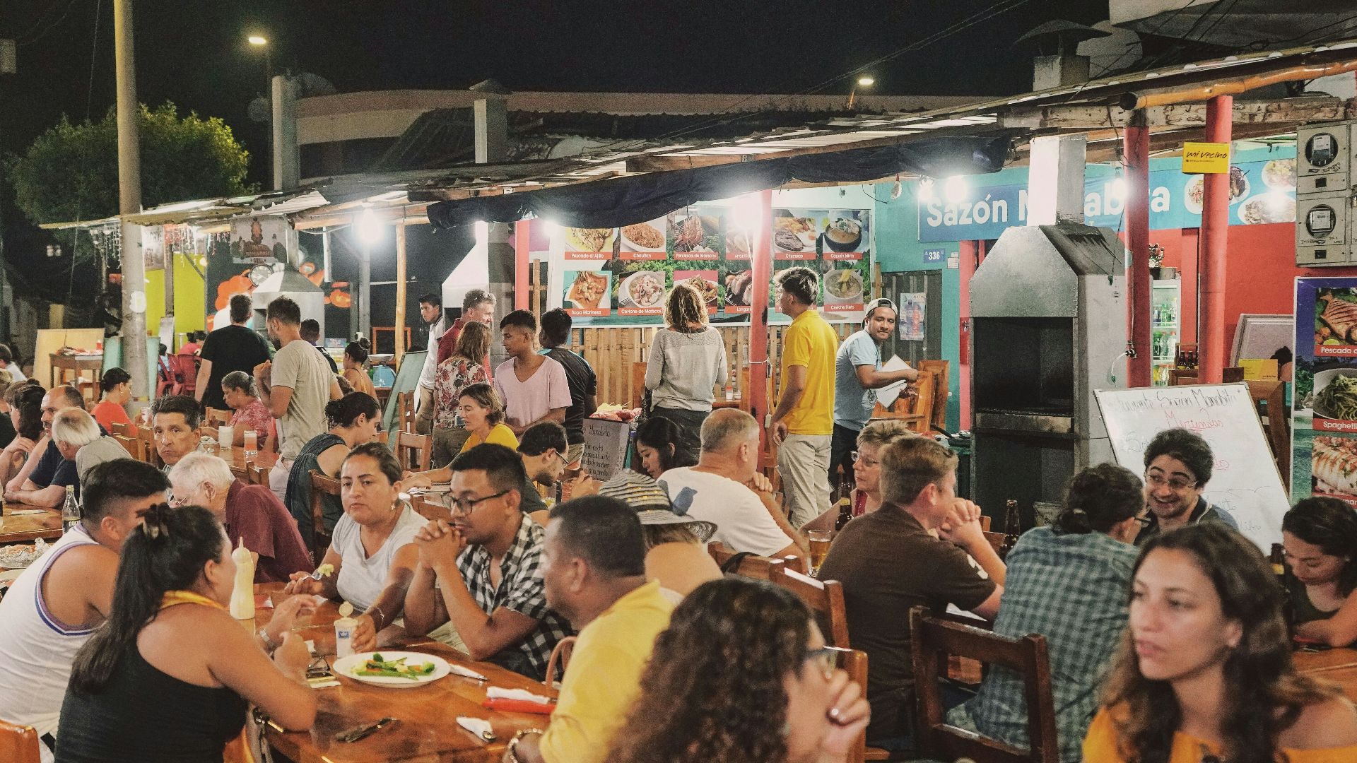 a group of people sitting at tables