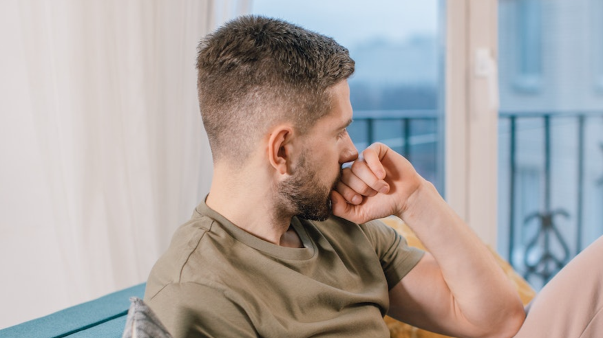 Man thinking and looking at side.