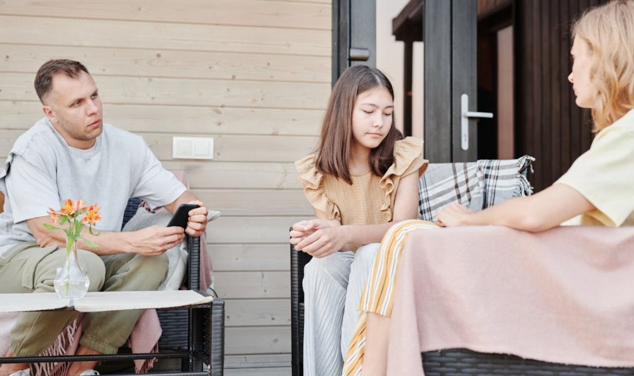 A Family Sitting on the Patio