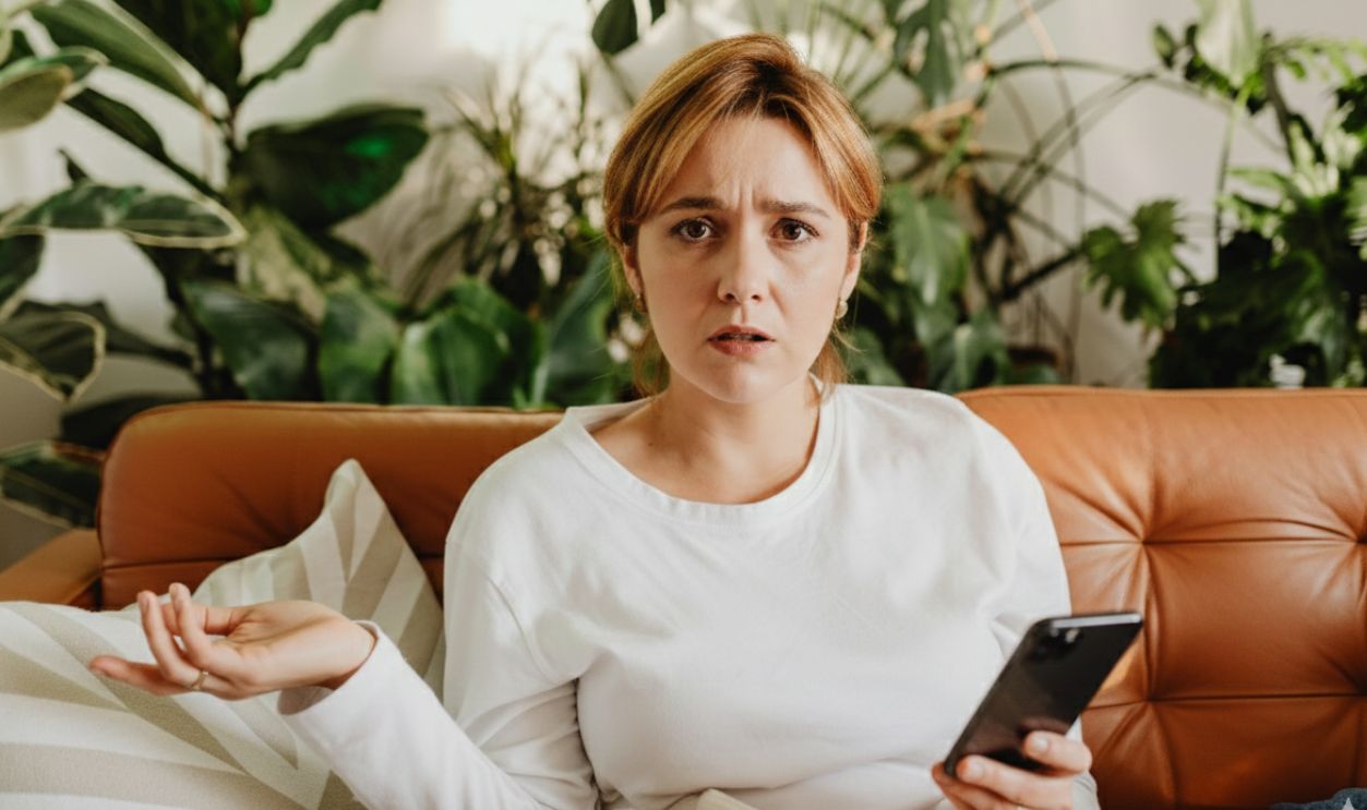 Woman holding her phone