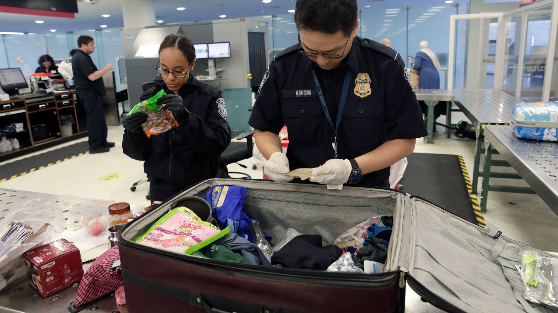 U.S. Customs and Border Protection agriculture specialists search luggage of arriving international passengers for prohibited agriculture products at Philadelphia International Airport in Philadelphia, Pa., July 29, 2024. CBP Photo by Glenn Fawcett
NOTE: Minimal blurring applied to protect PII