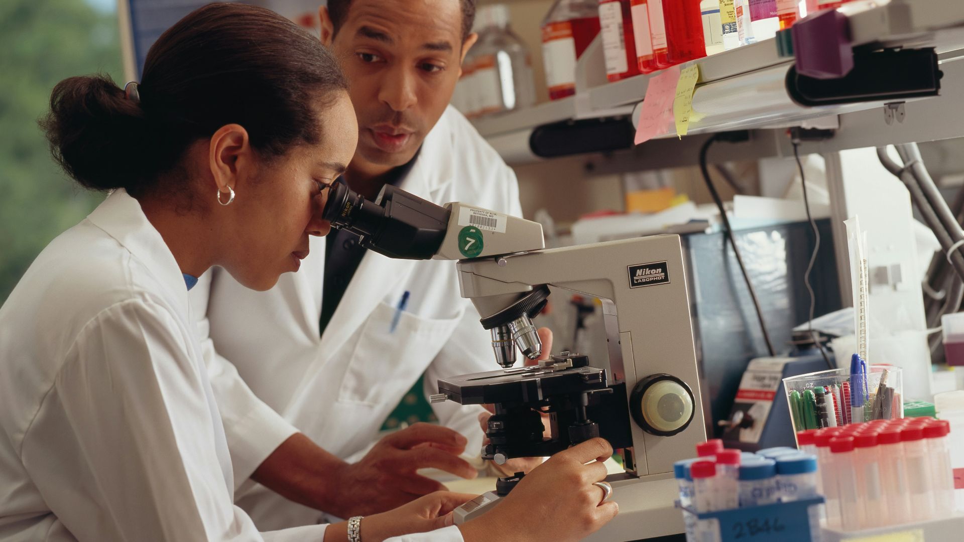 man in white chef uniform holding black and silver power tool