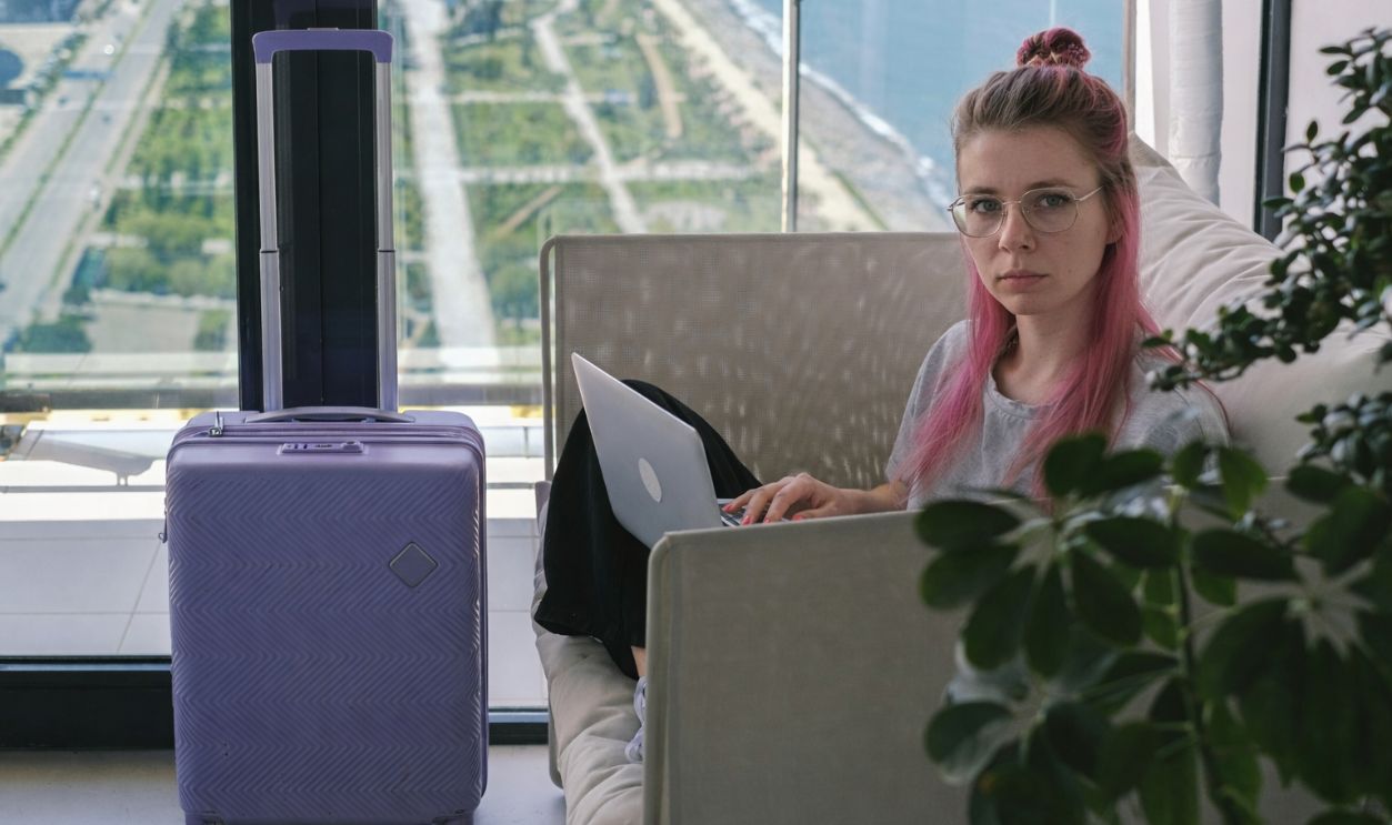 Woman using laptop at hotel