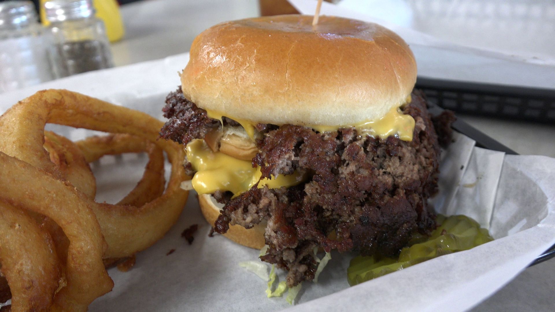 File:Burger and onion rings at The Workingman's Friend, 2024-10-06.png