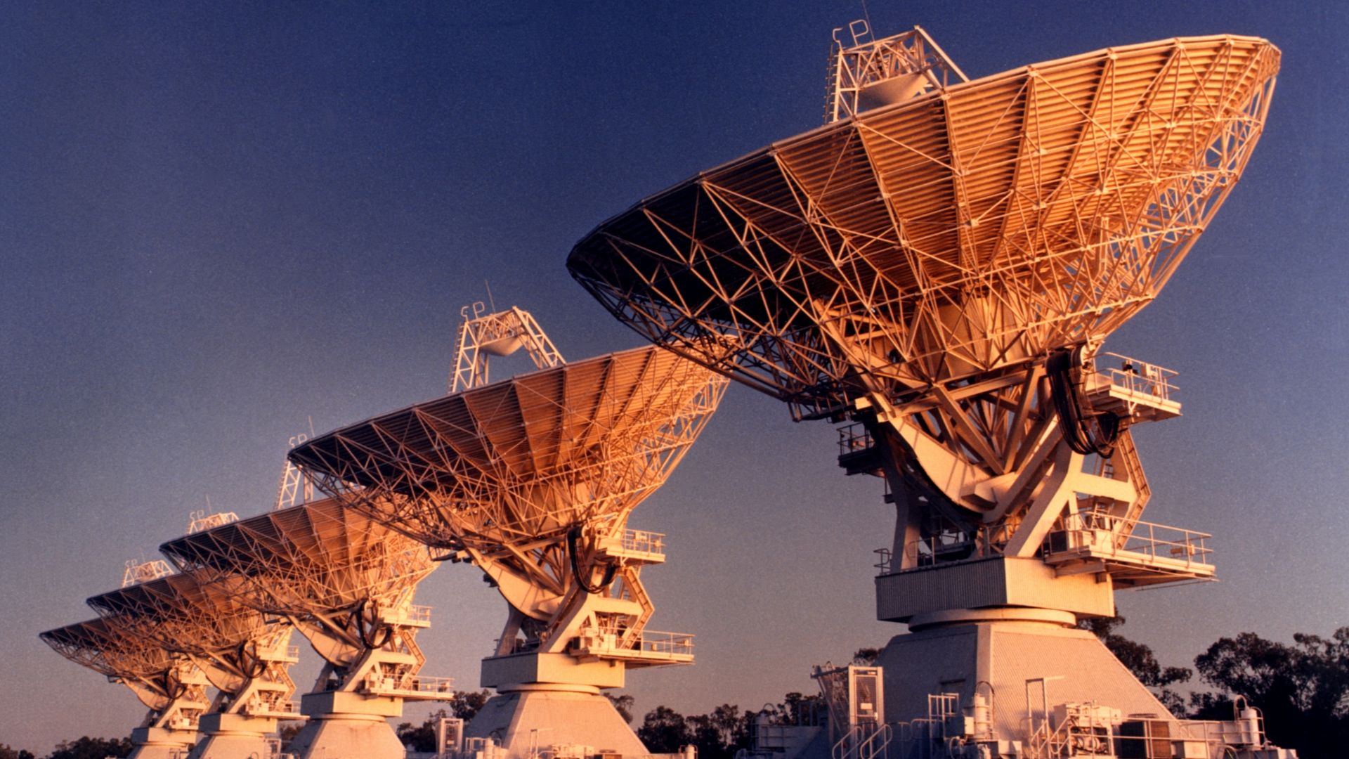 Five antennas of the Australia Telescope Compact Array, near Narrabri (New South Wales). This photograph was taken in the late phase of the construction process (~1984).