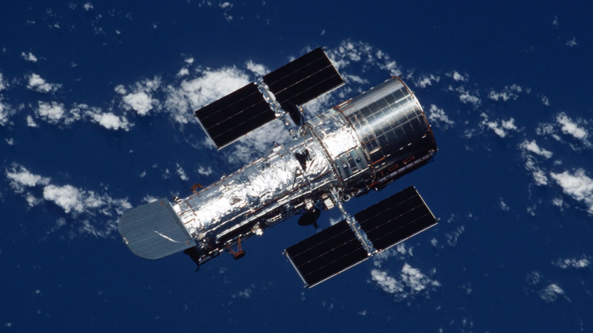 The Hubble Space Telescope (HST) heads back toward its normal routine in orbit, after a week of servicing and upgrading by the STS-109 astronaut crew on board the Space Shuttle Columbia in March 2002.