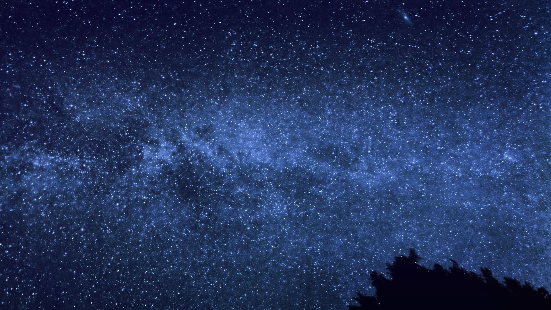 The Milky Way with the Andromeda Galaxy visible to the upper right hand side.