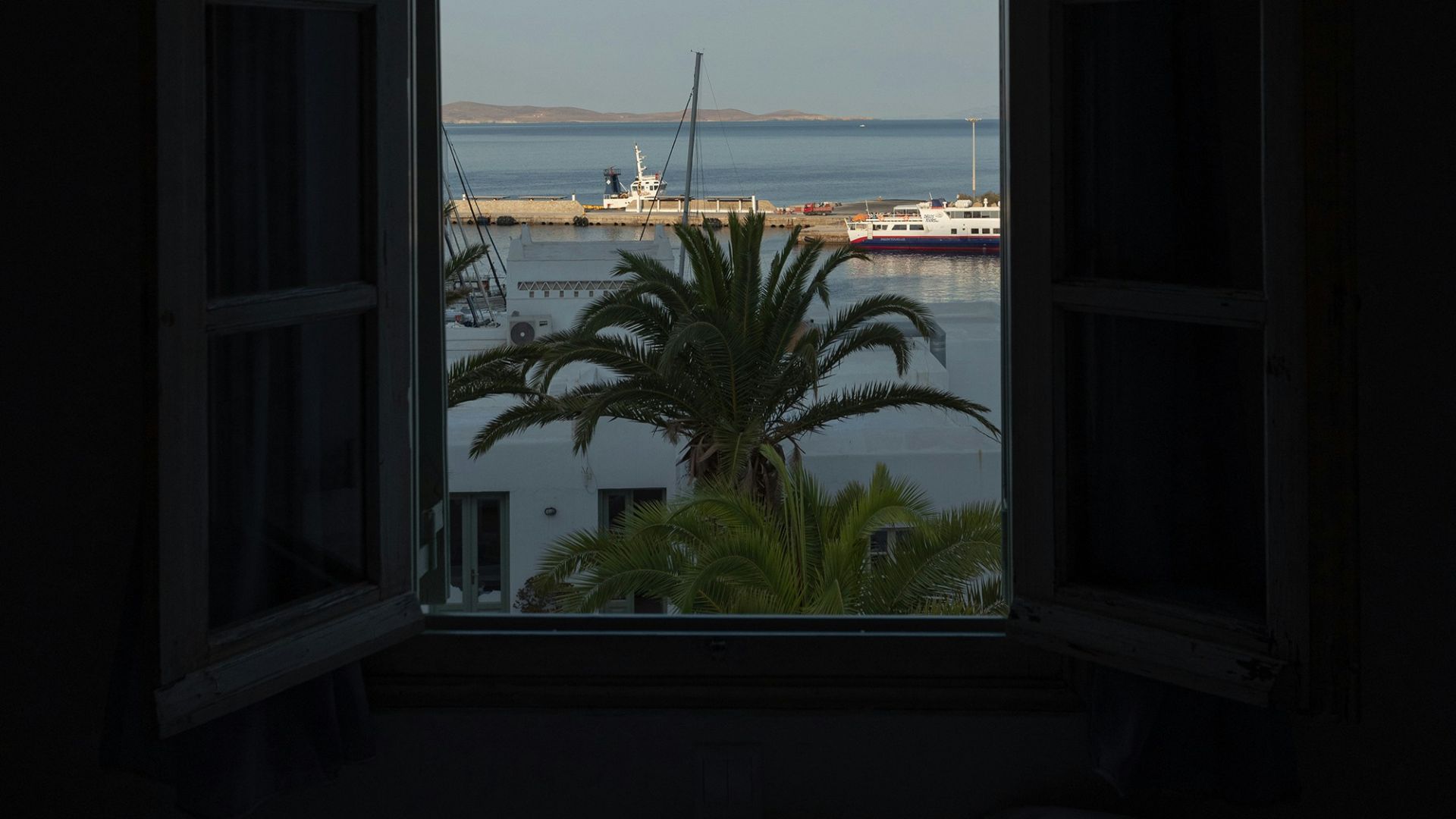 a window with a view of a body of water