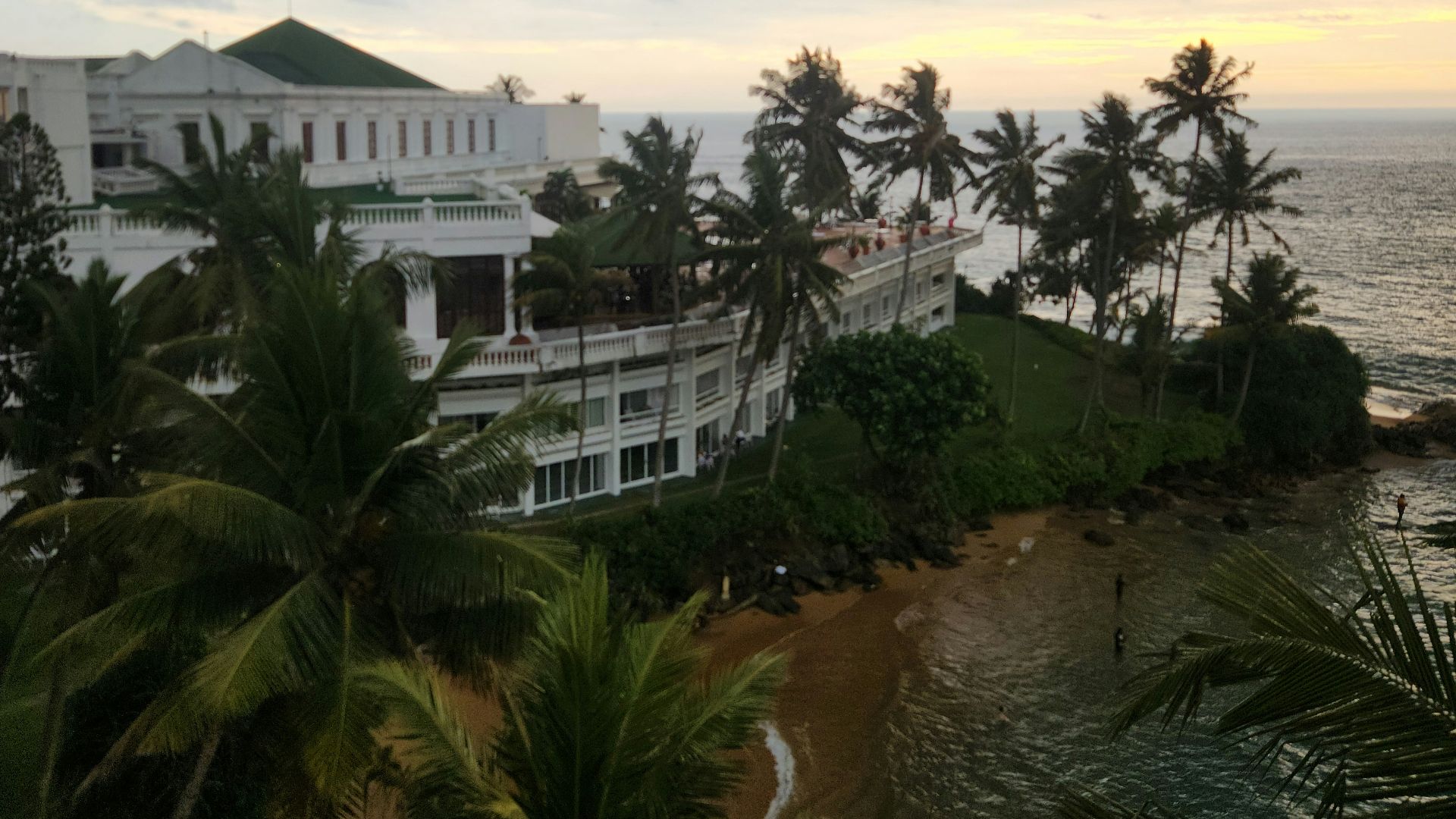 Tropical resort by the sea with cloudy sky.