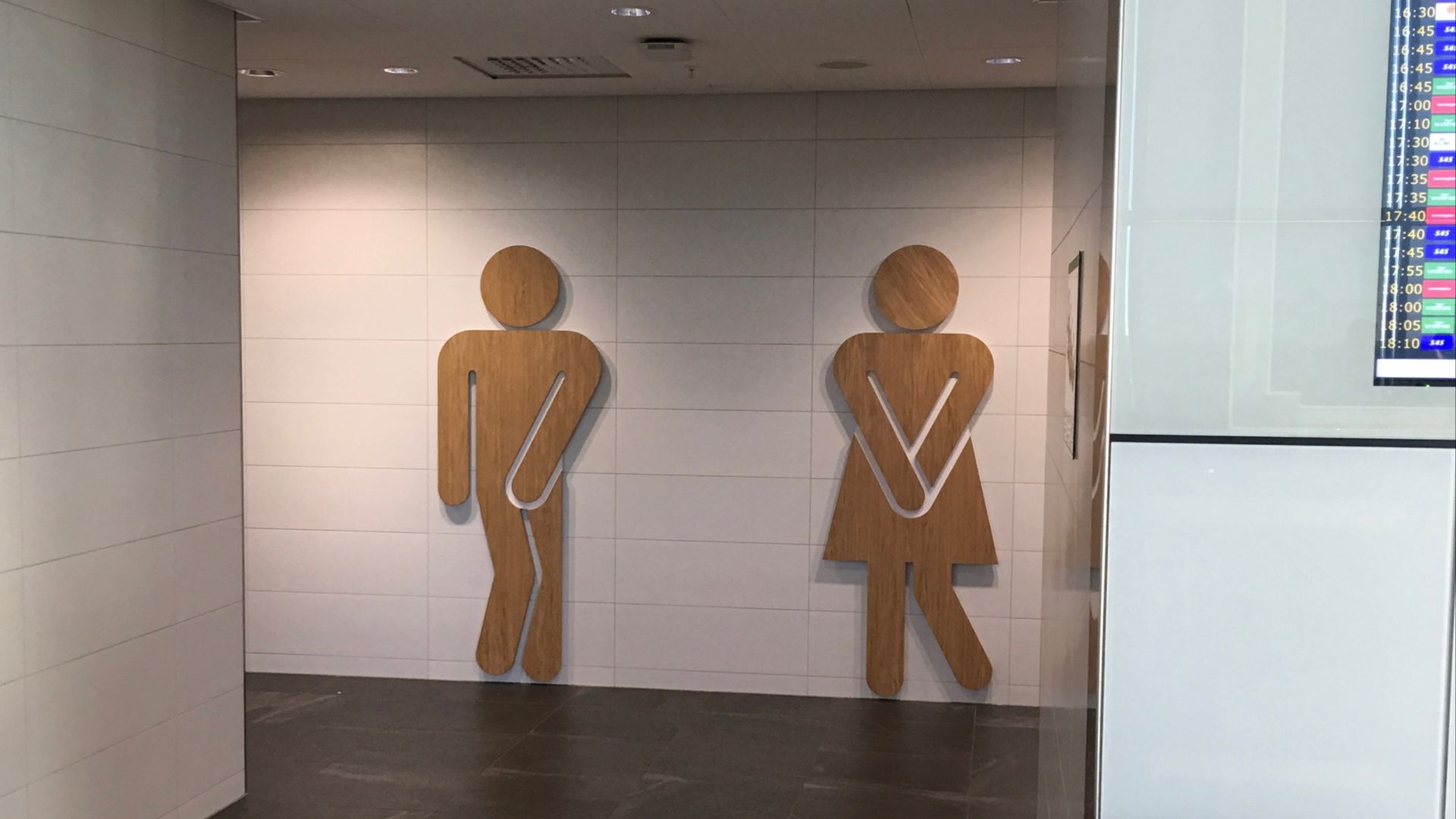 Toilet pictogram signs in terminal building at Bergen Airport, Flesland, Norway. November 2017