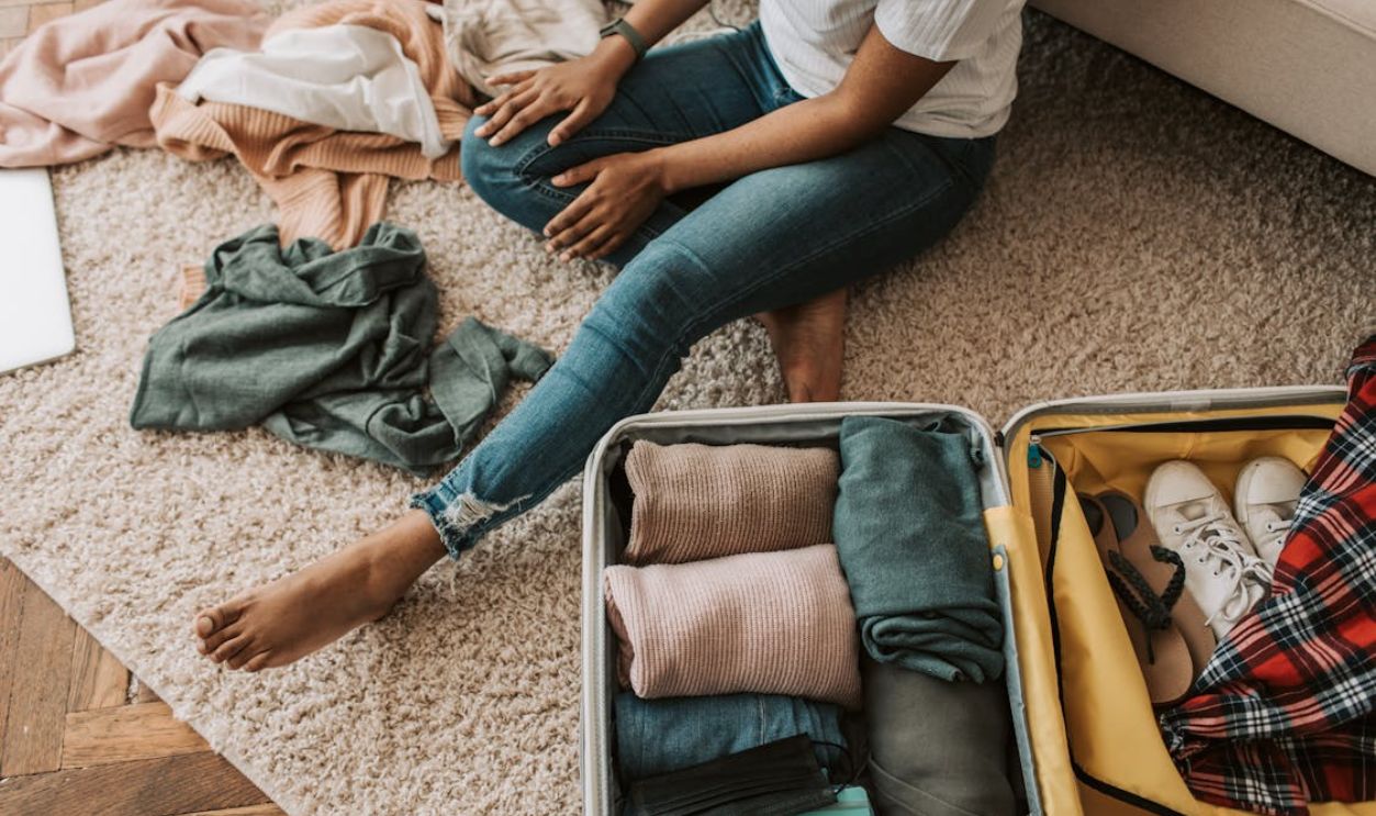 A Woman Packing Her Suitcase