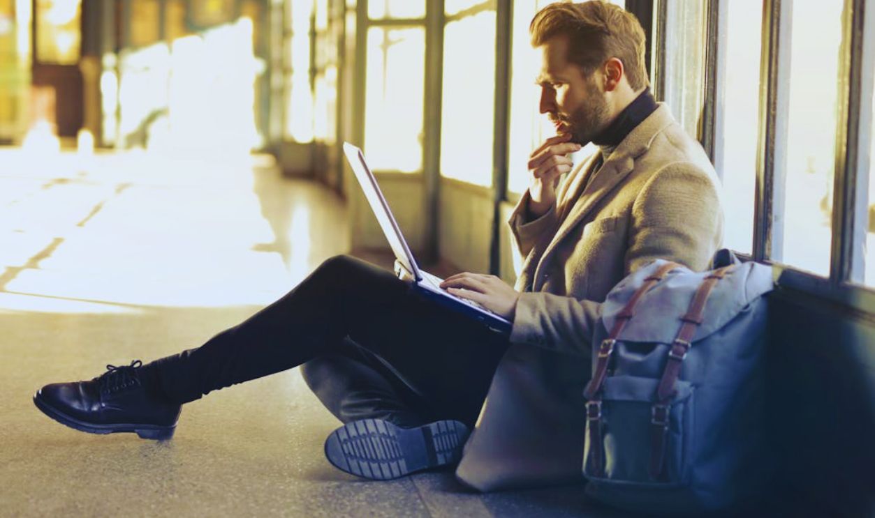 Brown Haired Man Using Laptop Computer