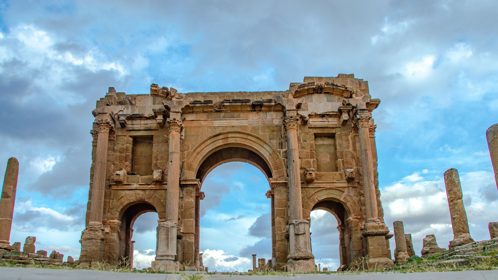 The Arch of Trajan is a Roman triumphal arch located in the colonia of Timgad (Ancient Thamugadi), near the city of Batna, Algeria. It was built between the later 2nd century and the early 3rd century.
The three vaulted arch composed the western gate of the city, at the beginning of the Decumanus Maximus and the end of the road coming from Lambaesis.