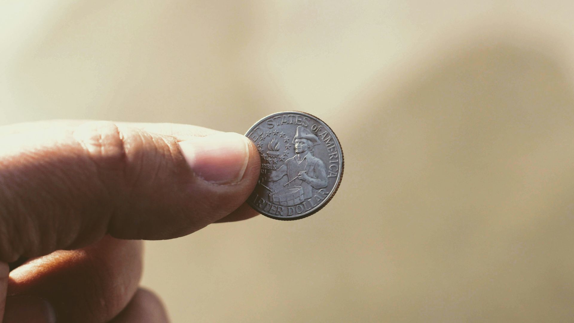 round silver-colored coin