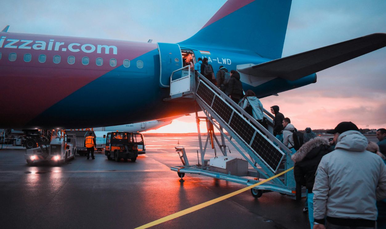 Photo of People Boarding Airliner