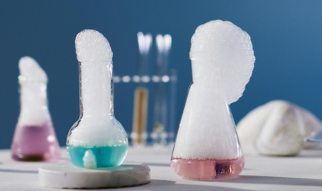 A Shot of Chemistry Flasks With Chemistry Reaction 