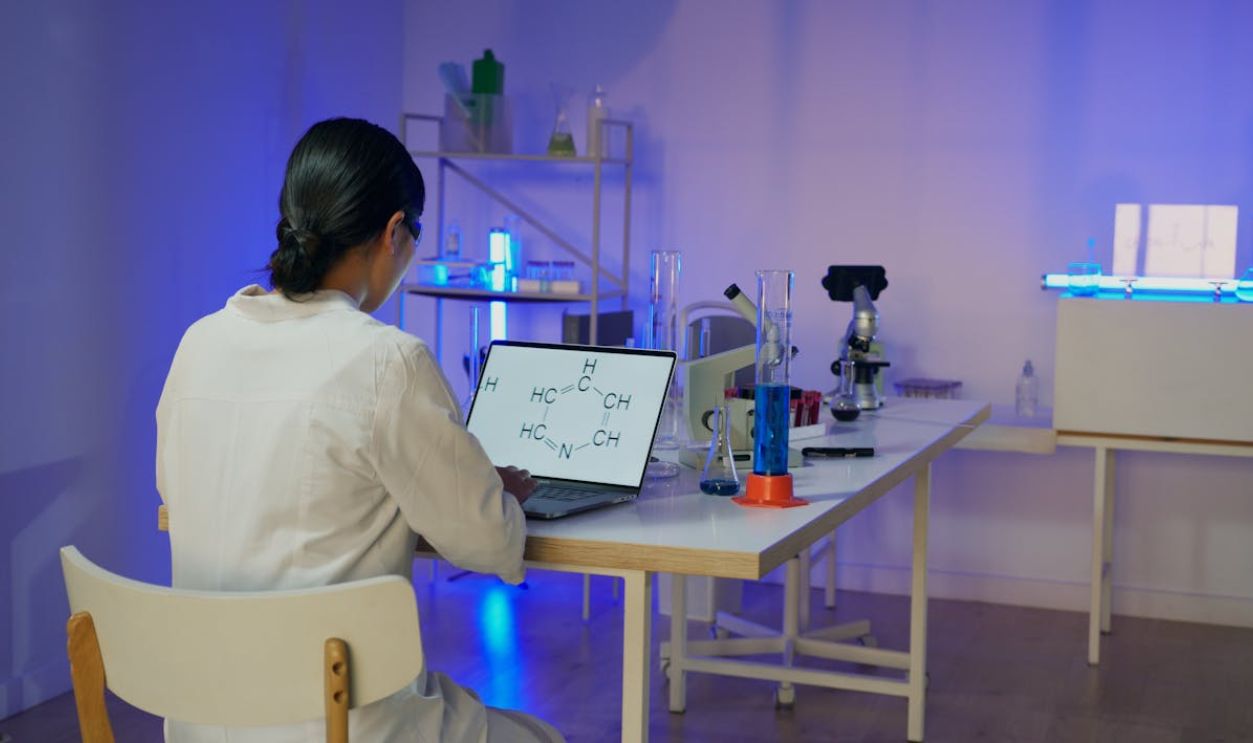 A Researcher Working on a Chemical Formula
