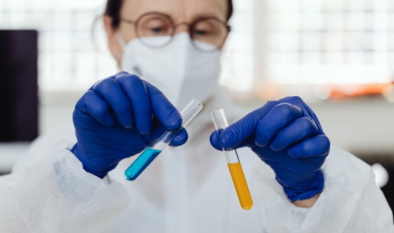 A Scientist Holding Two Test Tubes