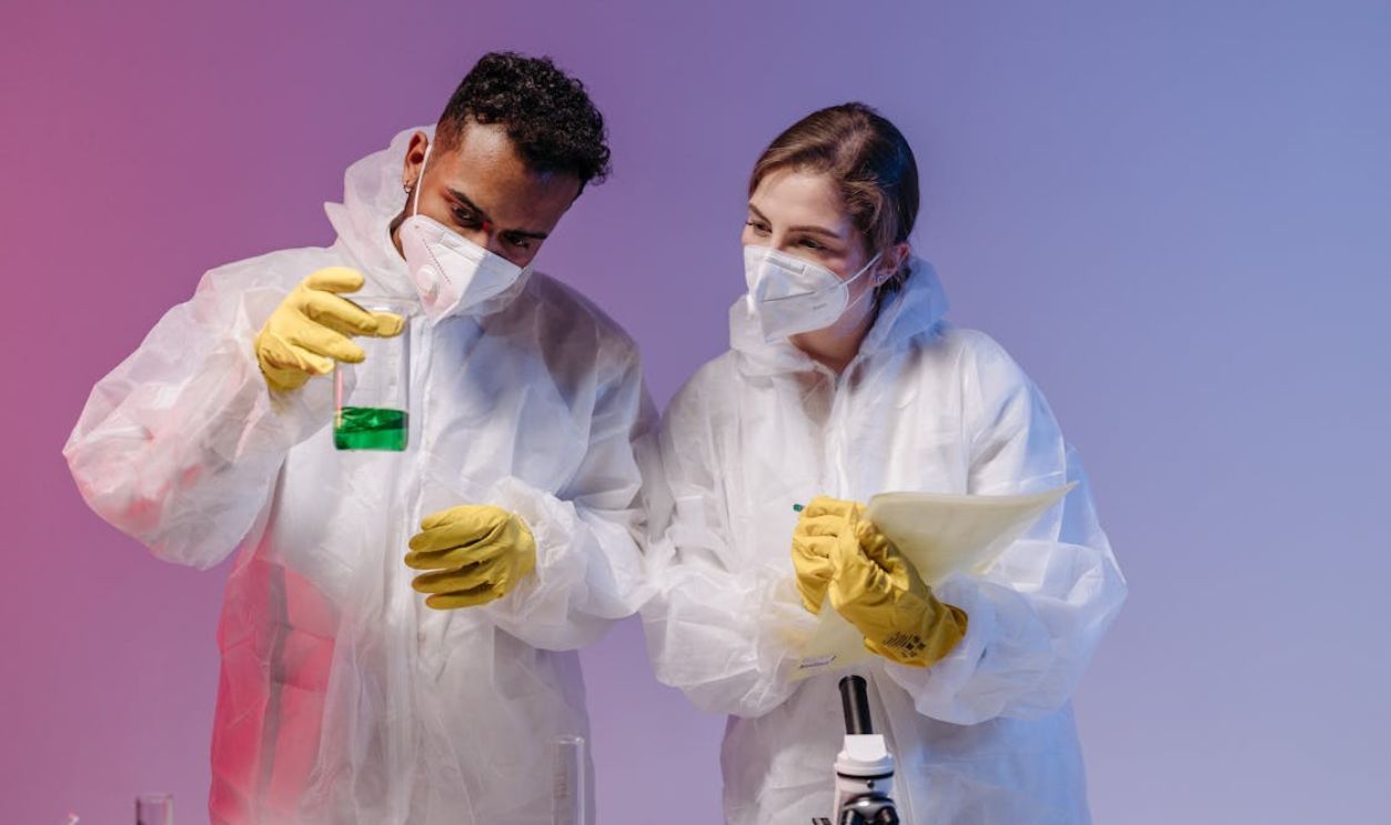 Scientists Holding Test Tubes