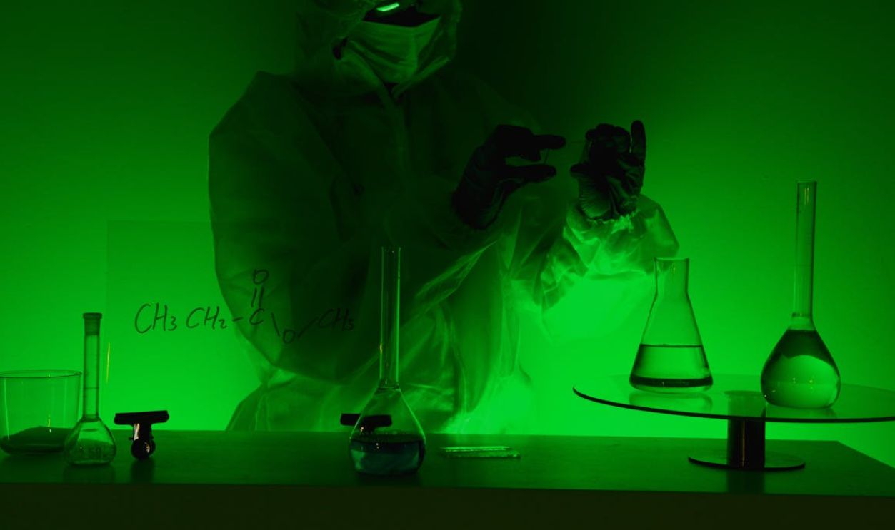 Scientist in Laboratoy in Green Light