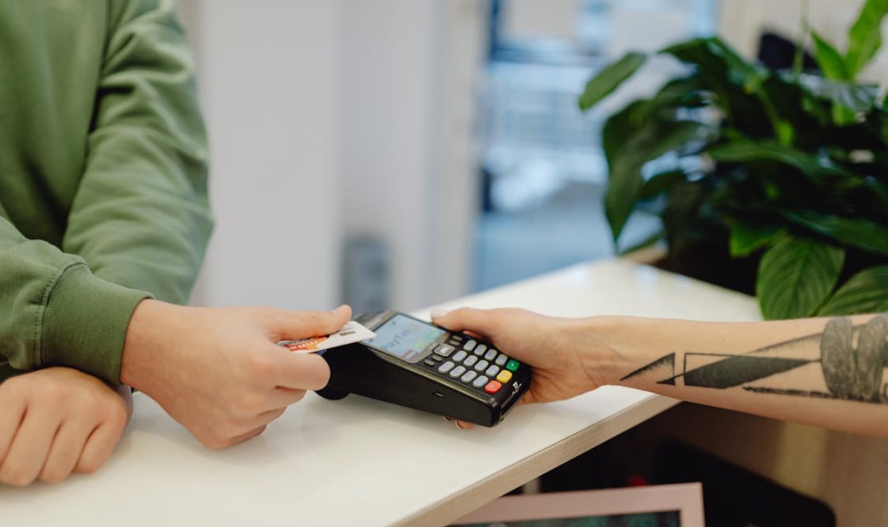 A Person Holding a Bank Card