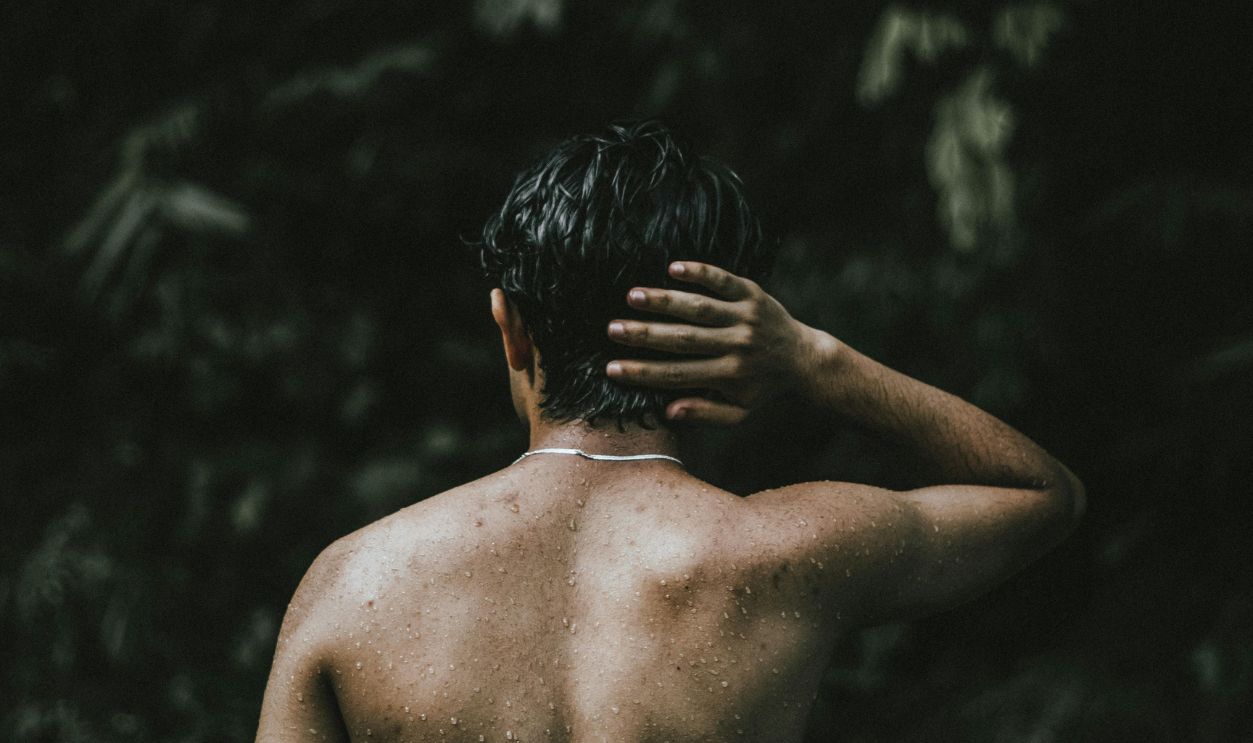 Wet Shirtless Man Near Trees