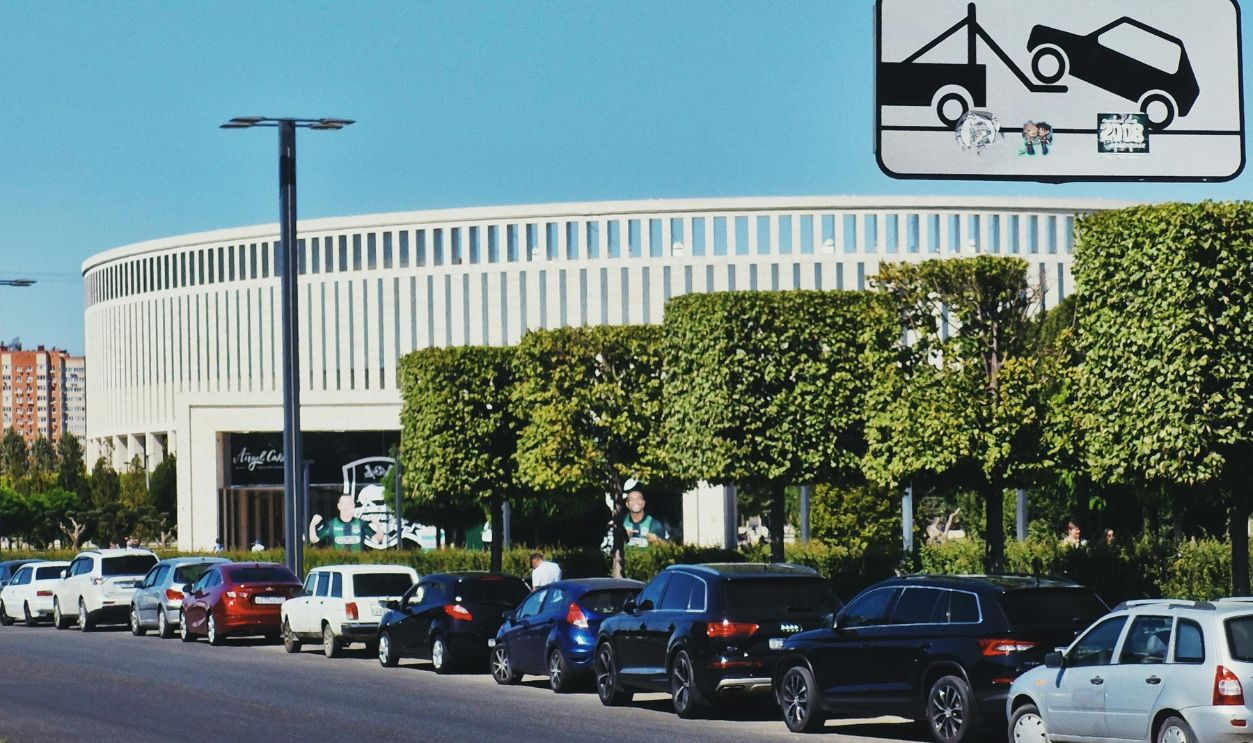 No Parking Sign with Busy Urban Roadway