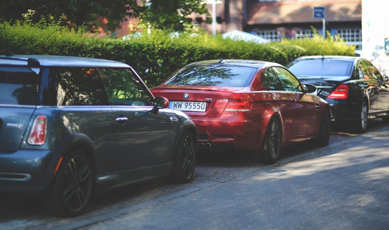 Cars parked along way