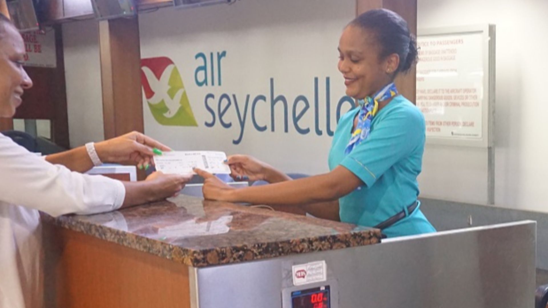 Mahe Airport in Seychelles - check-in counter with Air Seychelles logo