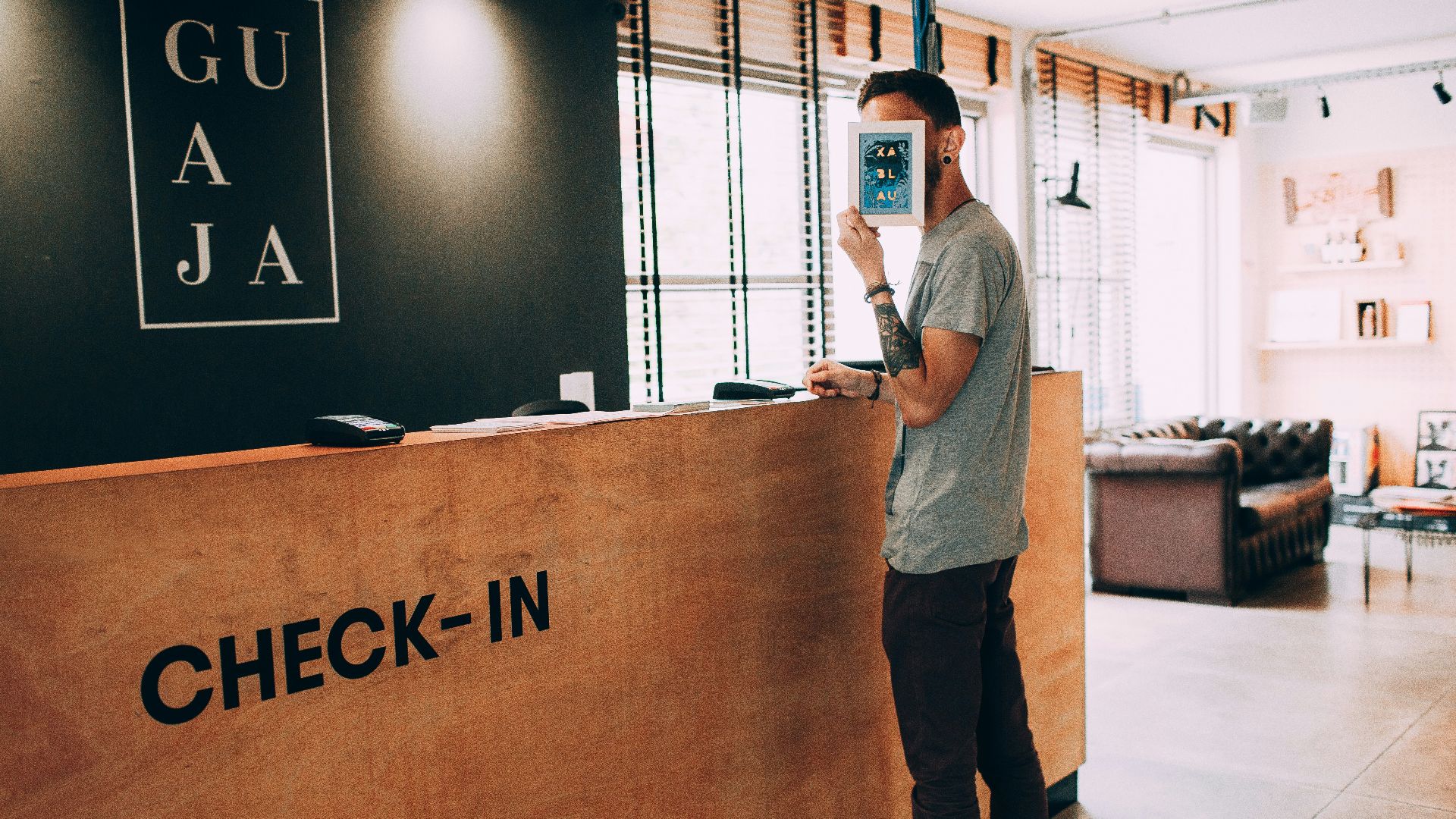 man standing beside counter