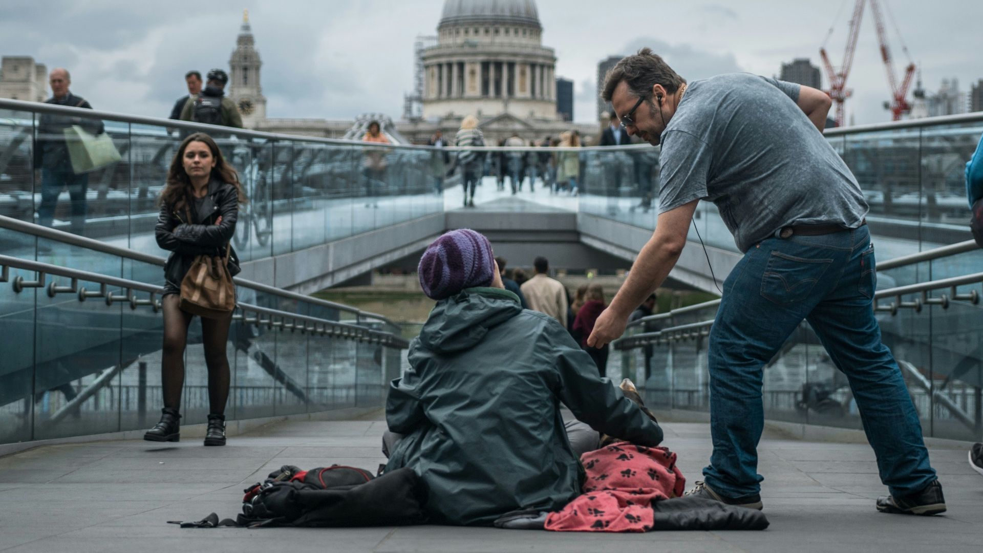 person sitting on floor near people