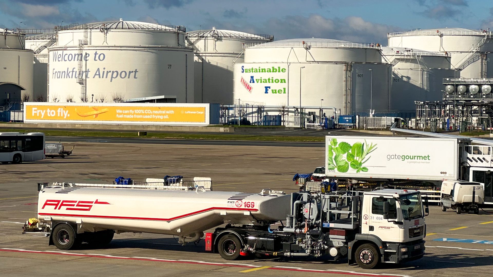 Sustainable Aviation Fuel advertisment on fuel storage at Frankfurt airport