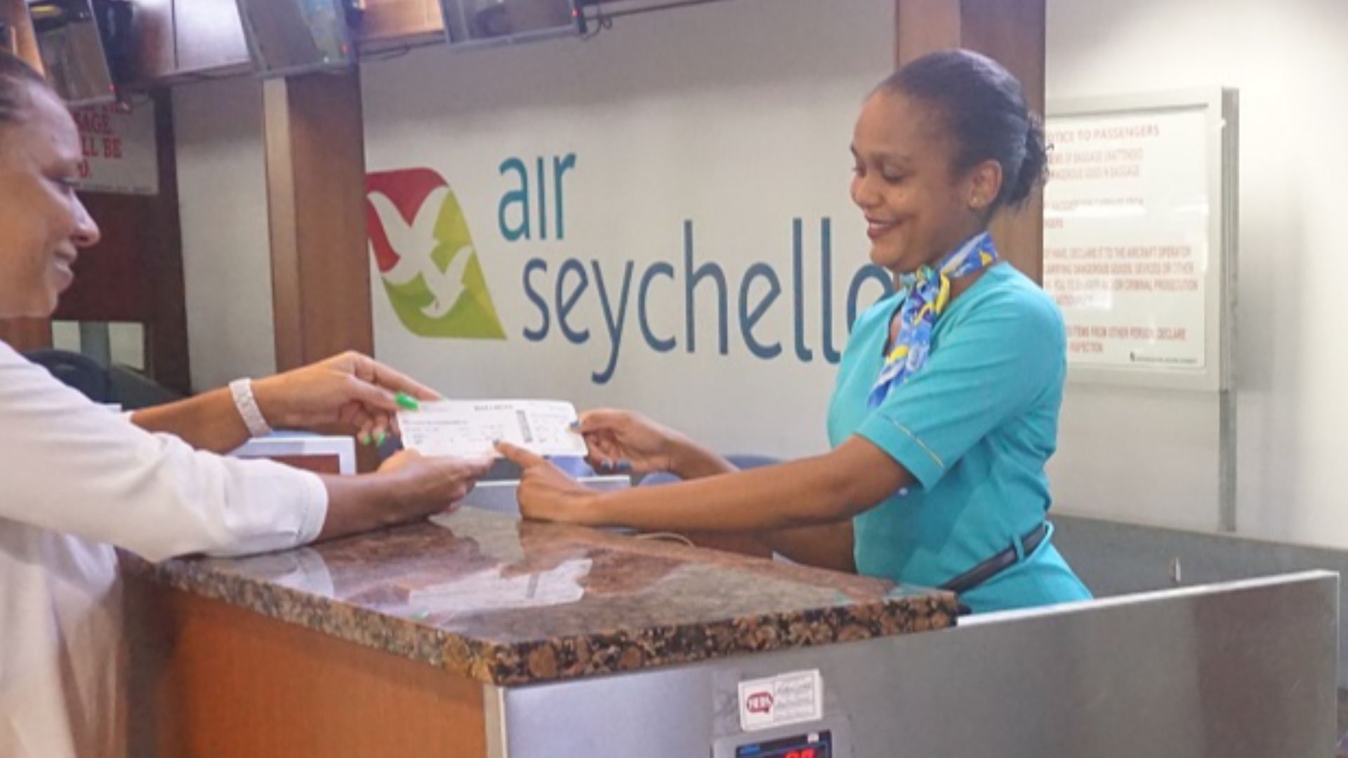Mahe Airport in Seychelles - check-in counter with Air Seychelles logo
