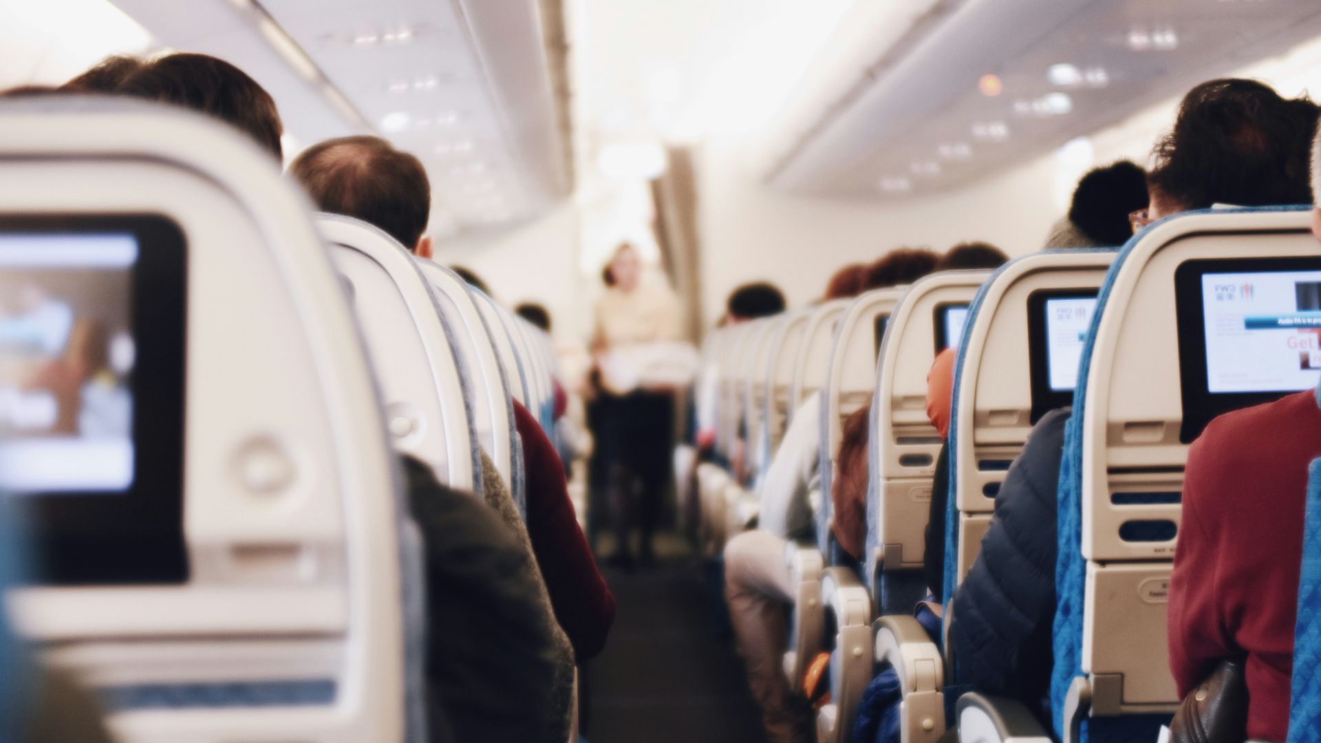 shallow focus photography of people inside of passenger plane